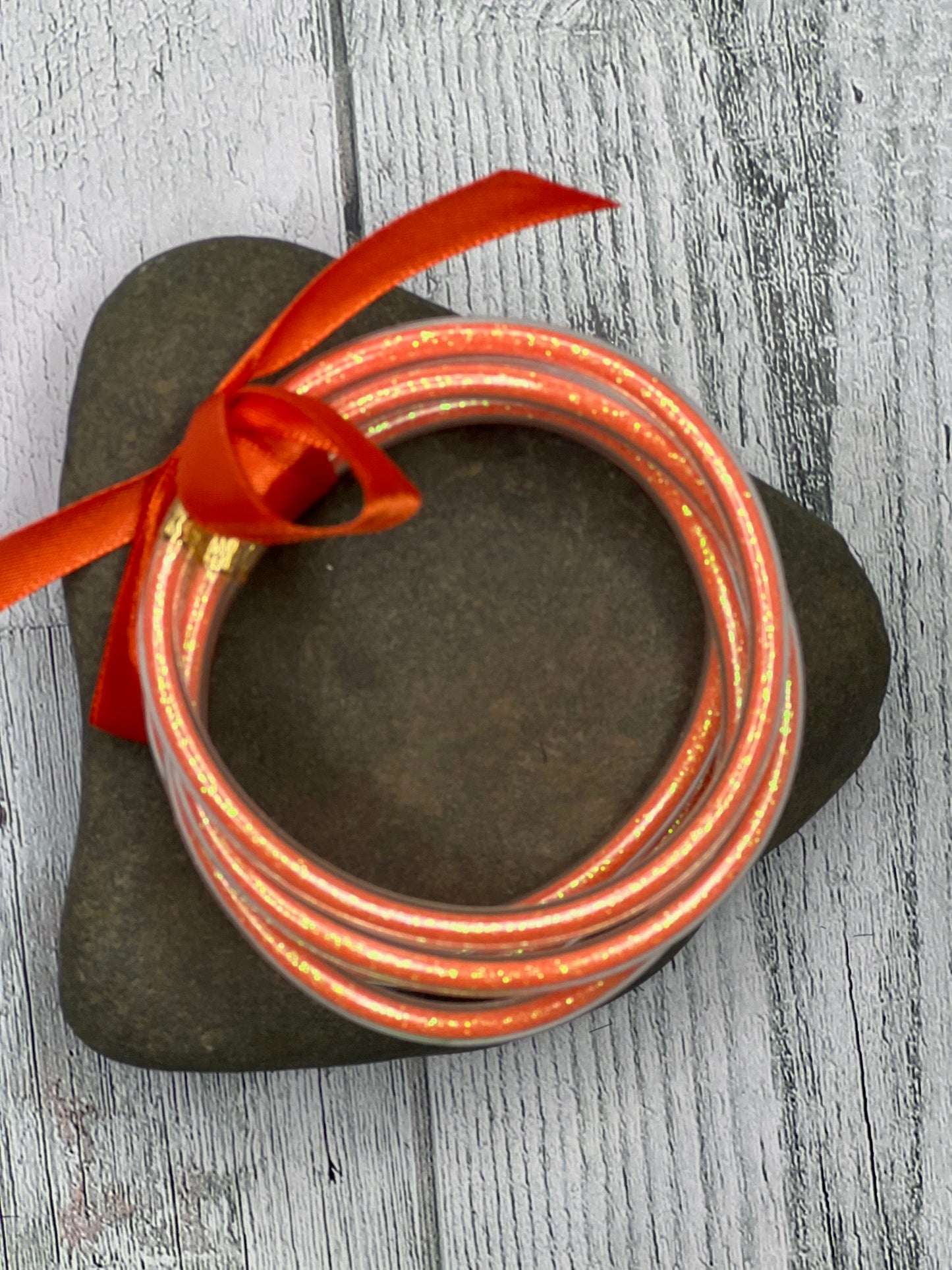 ORANGE JELLY BANGLES WITH GOLDEN GLITTER